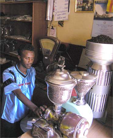 A coffee seller prepares his coffee grinders for business in downtown Asmara, Eritrea.