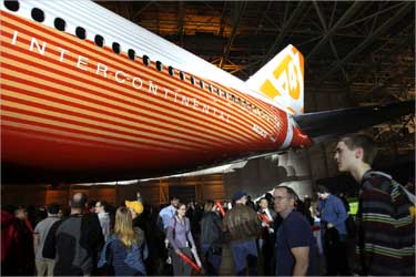 Thousands of Boeing employees and guests take a closer look at the fuselage of the brand new 747-8 jumbo passenger jet.