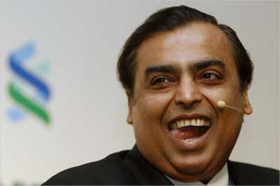 Mukesh Ambani reacts during the 2011 spring membership meeting organised by the IIF in New Delhi.