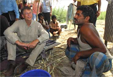 Bill Gates interacts with a villager in Aulali village, Bihar.