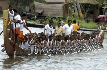 Oarsmen row their boat during a practice ahead of the Nehru boat race in Alleppy.