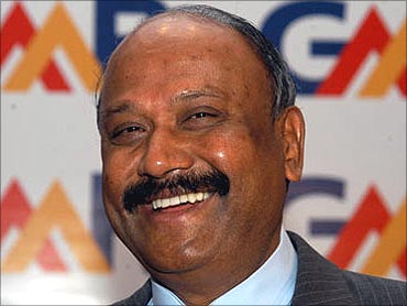 GM Rao has pledged entire stake to a foundation.