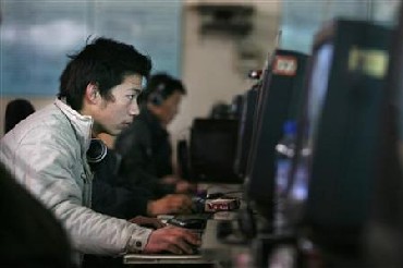 Chinese internet users go online at an internet shop in Beijing