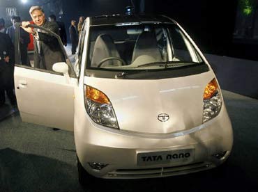 Tata Group chairman Rata Tata with the iconic Nano.