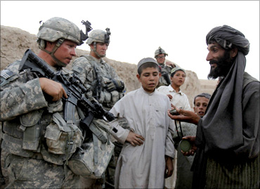 US soldiers with the C Troop 1-71 CAV chat with residents as they patrol in Gorgan, Afghanistan.