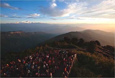 Visitors watch the sun rise from Tiger Hill near Darjeeling.