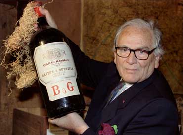 French designer Pierre Cardin presents a four-liter bottle of Chateau Margaux.