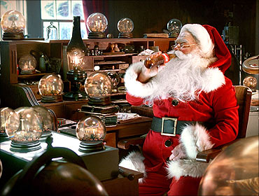 Santa Claus enjoys a Coca-Cola in this publicity image.