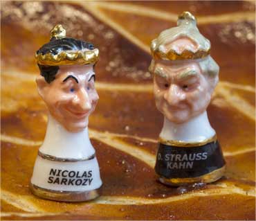 Two figurines representing France's President Nicolas Sarkozy (L) and Strauss-Kahn.