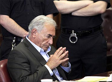Former IMF chief Dominique Strauss-Kahn gestures during his bail hearing inside of the New York State Supreme Courthouse in New York.