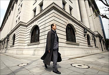 A man walks past insurance company Meiji Yasuda Life in Tokyo.