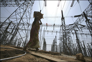 A labourer works at the construction site of a grid power station in Jammu.