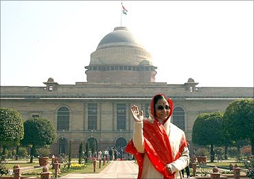President Pratibha Patil waves to photographers from the famous Mughal Garden.