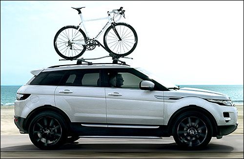 Range Rover Evoque: Accessory roof mounted bike carrier and accessory black wheels.