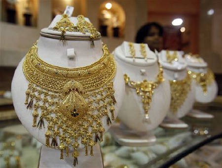 Gold costlier by Rs 50, silver plunges by Rs 200