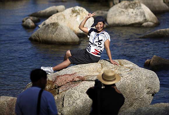 Members from a Chinese tourism delegation visit a beach area at Mount Kumgang resort in Kumgang.