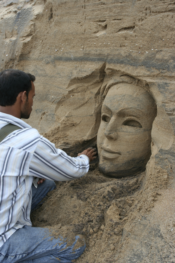 An artist works on a sculpture in Puri, Orissa.