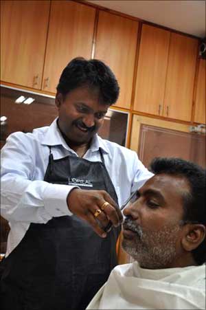 Ramesh Babu at his barber shop.