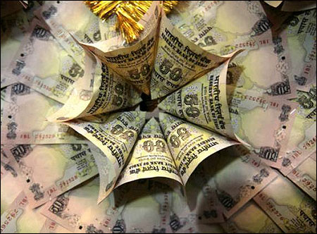Rupee hits 32-month low; may touch 51/US$