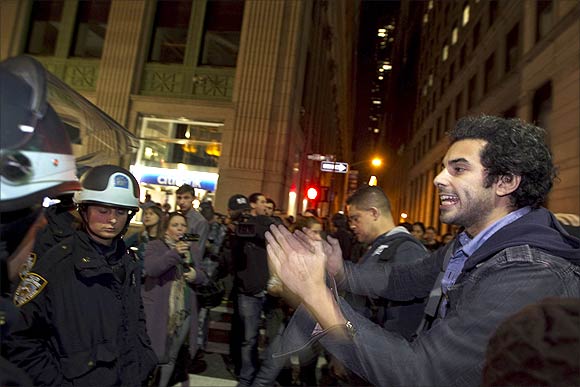 Members of the Occupy Wall St movement clash with New York Police Department officers after being removed from Zuccotti Park in New York.