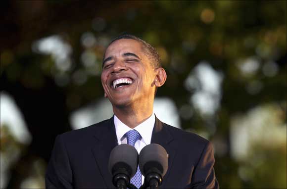 US President Barack Obama laughs during his press conference at the conclusion of the APEC Summit in Honolulu, Hawaii.