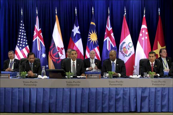 US President Barack Obama (C) speaks at the Trans-Pacific Partnership Leaders meeting at the Hale Koa Hotel during the APEC Summit in Honolulu, Hawaii.