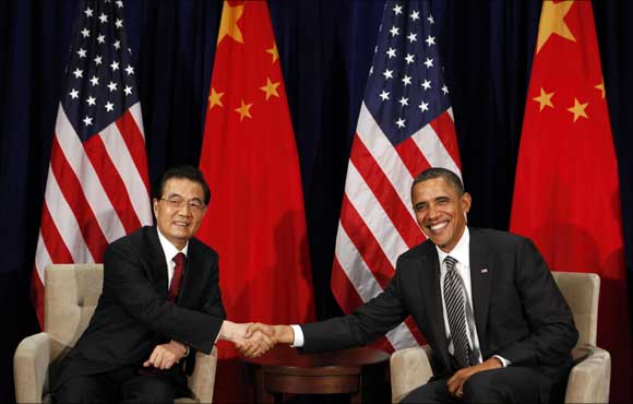 US President Barack Obama and Chinese President Hu Jintao shake hands during the APEC Summit.