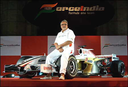 Mallya, poses with the new Force India Formula One Team car on display at the launch held infront of the Gateway of India February 7, 2008 in Mumbai.