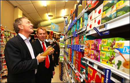 Labour leader Phil Goff and Chris Hipkins discuss food prices at Stokes Valley New World supermarket in Wellington, New Zealand.