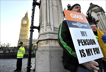 Pickets stand outside the Houses of Parliament in central London.