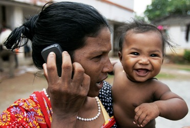 A woman speaks on a mobile phone at a refugee camp in Bhubaneswar.