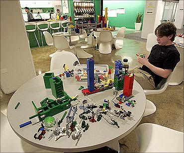 An employee plays with lego at the New York City offices of Google.
