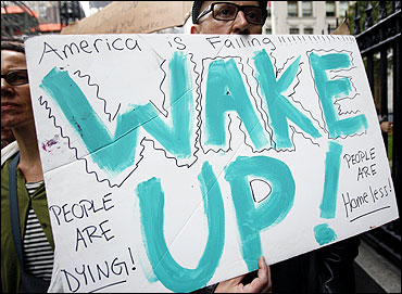 A protester marches with a sign during an Occupy Wall Street protest in New York.