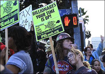 Protesters march in support of the New York Occupy Wall Street protests outside City Hall in Los Angeles.