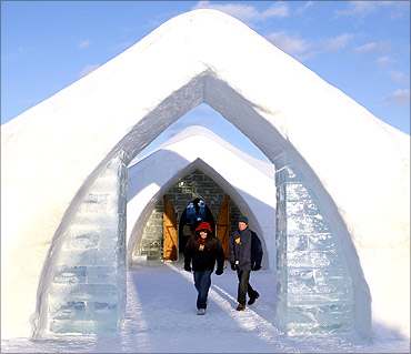 Visitors walk out of Ice Hotel in Quebec.