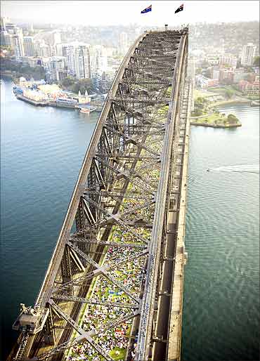 People eat breakfast at the Sydney Harbour Bridge in Central Sydney.