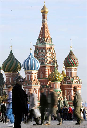 A tourist stands in front of St Basil's cathedral on Moscow's Red Square.