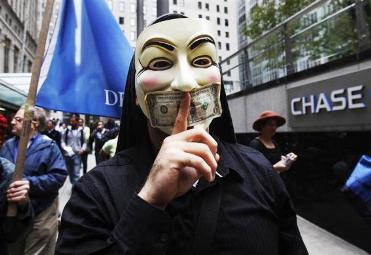 An Occupy Wall Street demonstrator marches around the Chase banking offices near Wall Street in New York.