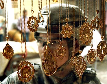 A US soldier passes a jewellery shop during a patrol in Baquba.