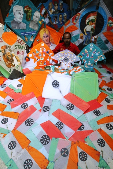 Kite-maker Jagmohan Kanojia displays kites, made with Indian national symbols and pictures of independence heroes.