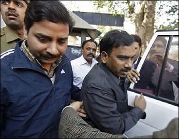 (Former telecom minister A Raja (C) arrives at a court for a hearing in New Delhi.