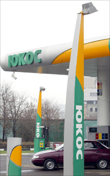 A car stands at the petrol station of the Russia's oil major Yukos.