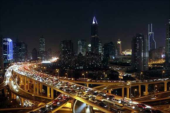 Vehicles drive on flyovers during the evening rush hour in central Shanghai.