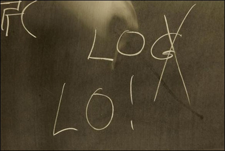 A blackboard with the letters LOG and LO.