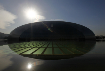 National Grand Theatre, also known as the 'egg', is reflected in the water in central Beijing.
