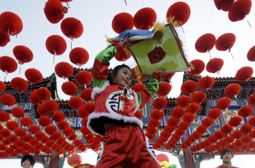 A dancer performs during the opening ceremony of the Spring Festival Temple Fair at the Temple of Earth park in Beijing.