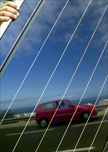 A car is reflected on a solar panel in Santa Cruz de Tenerife in Spanish Canary Island of Tenerife.