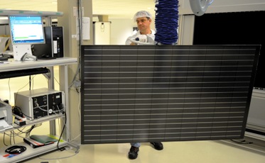 A worker builds a solar panel in a factory in Sainte Marguerite, Eastern France.