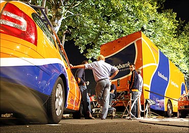 Rabobank team personnel stand by team vehicles in the Mercure Hotel car park in Pau.
