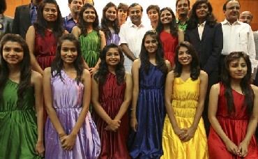 Mukesh Ambani poses for a picture with students from PDPU